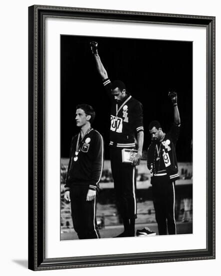 African American Track Star Tommie Smith, John Carlos After Winning Gold and Bronze Olympic Medal-John Dominis-Framed Premium Photographic Print