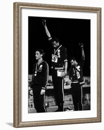 African American Track Star Tommie Smith, John Carlos After Winning Gold and Bronze Olympic Medal-John Dominis-Framed Premium Photographic Print