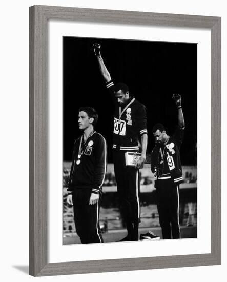 African American Track Star Tommie Smith, John Carlos After Winning Gold and Bronze Olympic Medal-John Dominis-Framed Premium Photographic Print