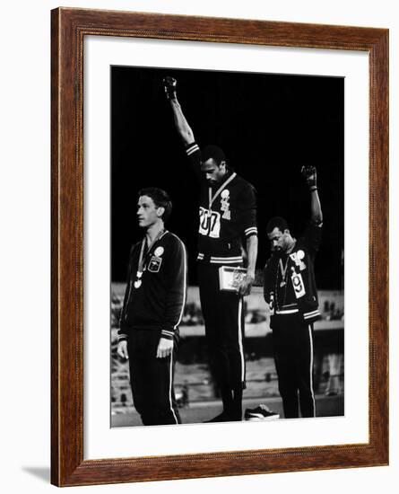 African American Track Star Tommie Smith, John Carlos After Winning Gold and Bronze Olympic Medal-John Dominis-Framed Premium Photographic Print