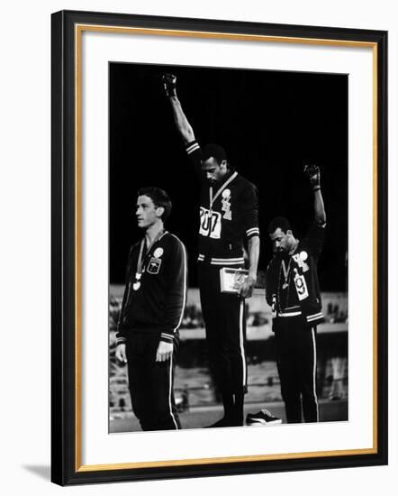 African American Track Star Tommie Smith, John Carlos After Winning Gold and Bronze Olympic Medal-John Dominis-Framed Premium Photographic Print