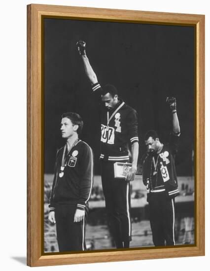 African-American Track Stars Tommie Smith and John Carlos after Winning Olympic Medals-John Dominis-Framed Premier Image Canvas