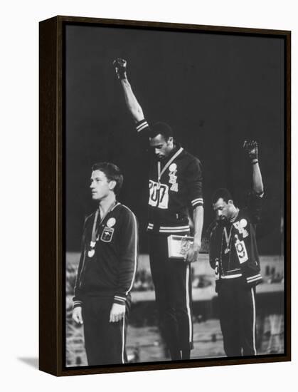 African-American Track Stars Tommie Smith and John Carlos after Winning Olympic Medals-John Dominis-Framed Premier Image Canvas