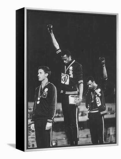 African-American Track Stars Tommie Smith and John Carlos after Winning Olympic Medals-John Dominis-Framed Premier Image Canvas