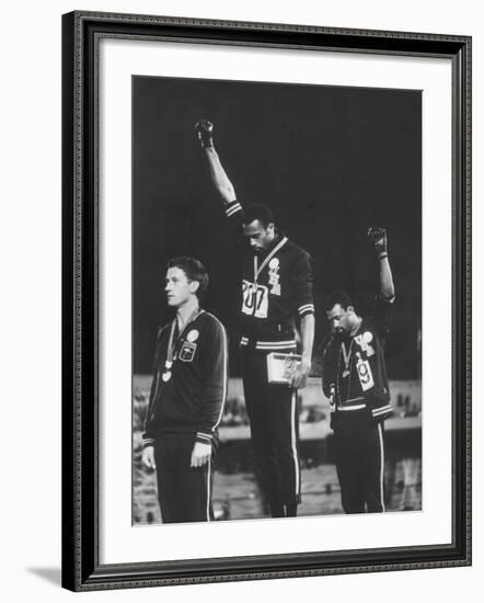 African-American Track Stars Tommie Smith and John Carlos after Winning Olympic Medals-John Dominis-Framed Premium Photographic Print