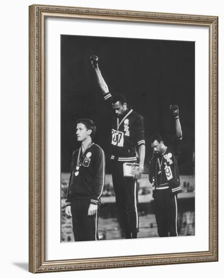 African-American Track Stars Tommie Smith and John Carlos after Winning Olympic Medals-John Dominis-Framed Premium Photographic Print