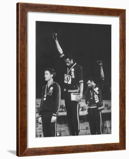 African-American Track Stars Tommie Smith and John Carlos after Winning Olympic Medals-John Dominis-Framed Premium Photographic Print