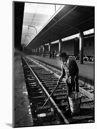 African American Woman Picking Up Debris on Tracks at Union Station-Alfred Eisenstaedt-Mounted Photographic Print