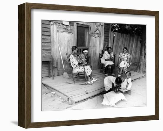 African American Women Sitting on the Porch of their Ramshackle House Watching their Children Play-Alfred Eisenstaedt-Framed Photographic Print