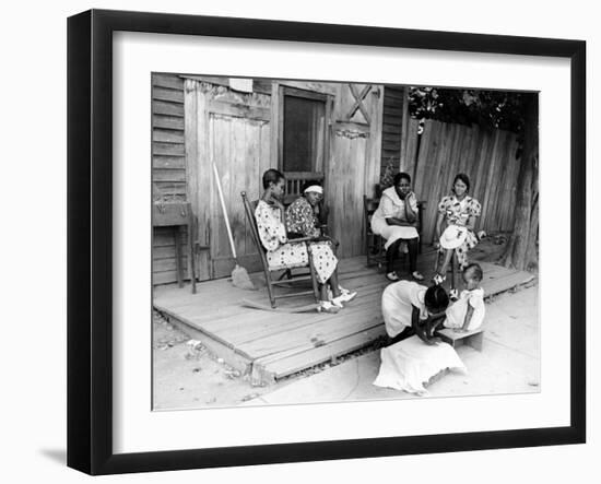 African American Women Sitting on the Porch of their Ramshackle House Watching their Children Play-Alfred Eisenstaedt-Framed Photographic Print