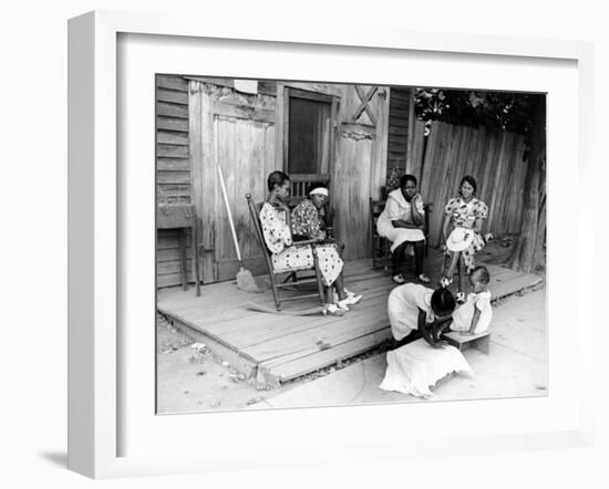 African American Women Sitting on the Porch of their Ramshackle House Watching their Children Play-Alfred Eisenstaedt-Framed Photographic Print