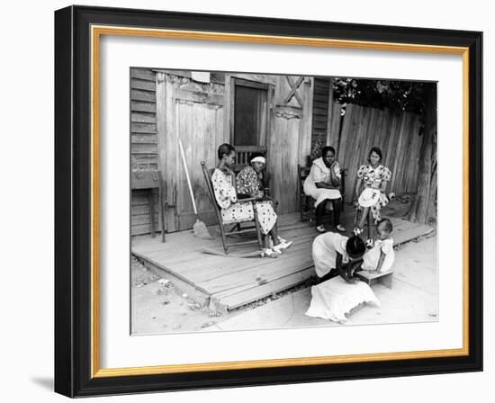 African American Women Sitting on the Porch of their Ramshackle House Watching their Children Play-Alfred Eisenstaedt-Framed Photographic Print