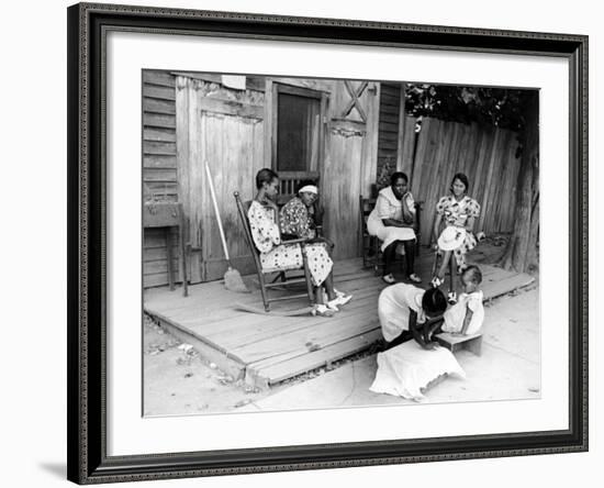 African American Women Sitting on the Porch of their Ramshackle House Watching their Children Play-Alfred Eisenstaedt-Framed Photographic Print