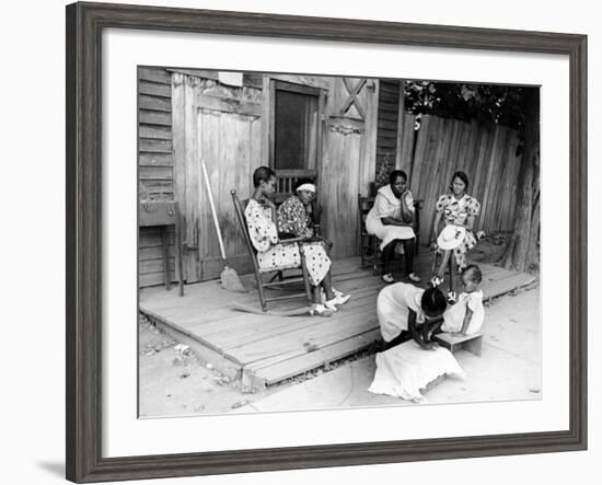 African American Women Sitting on the Porch of their Ramshackle House Watching their Children Play-Alfred Eisenstaedt-Framed Photographic Print