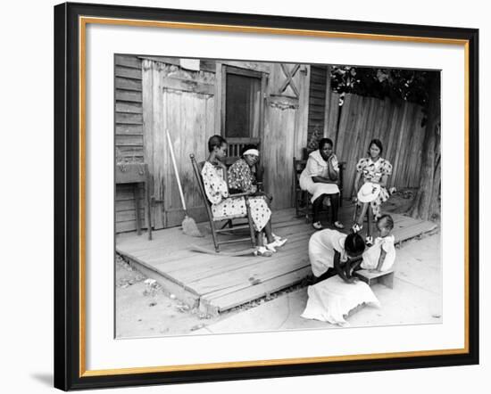 African American Women Sitting on the Porch of their Ramshackle House Watching their Children Play-Alfred Eisenstaedt-Framed Photographic Print