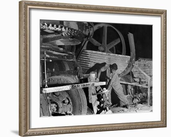 African American Worker Mrs. Rosalie Ivy Using Shovel to Mix a Special Mud Used to Seal the Hole-Margaret Bourke-White-Framed Photographic Print