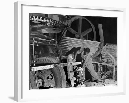 African American Worker Mrs. Rosalie Ivy Using Shovel to Mix a Special Mud Used to Seal the Hole-Margaret Bourke-White-Framed Photographic Print