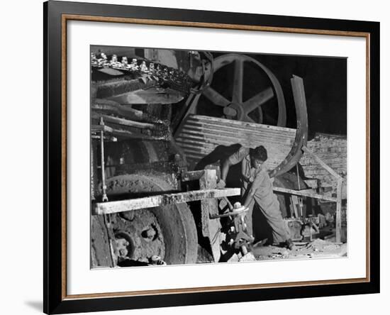 African American Worker Mrs. Rosalie Ivy Using Shovel to Mix a Special Mud Used to Seal the Hole-Margaret Bourke-White-Framed Photographic Print