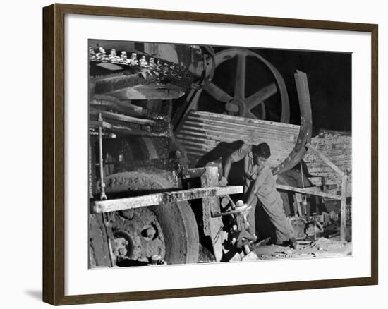 African American Worker Mrs. Rosalie Ivy Using Shovel to Mix a Special Mud Used to Seal the Hole-Margaret Bourke-White-Framed Photographic Print