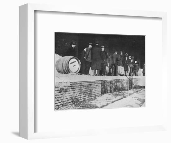 'After the Declaration of War: German beer being run away at an Italian Customs store', 1915-Unknown-Framed Photographic Print