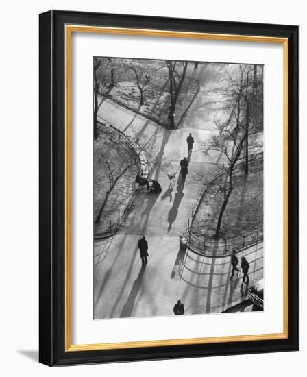 Afternoon Sunlight Casting Long Shadows in Washington Square Park-Yale Joel-Framed Photographic Print