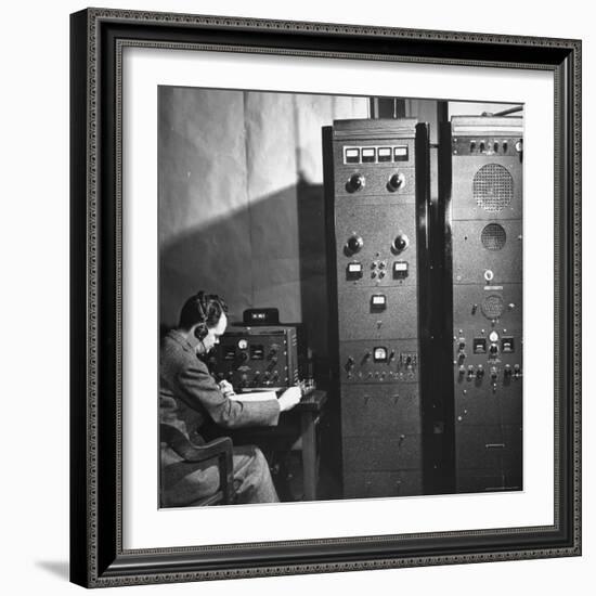 Agent of the FBI Listening to a Message Being Transferred Via Radio-Thomas D^ Mcavoy-Framed Photographic Print