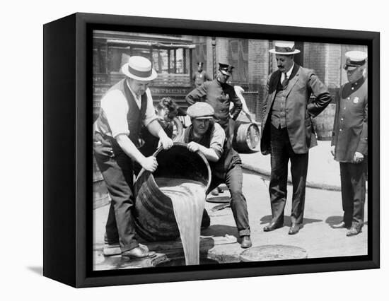 Agents pour liquor into sewer following a raid during the height of prohibition, New York, 1921-null-Framed Premier Image Canvas