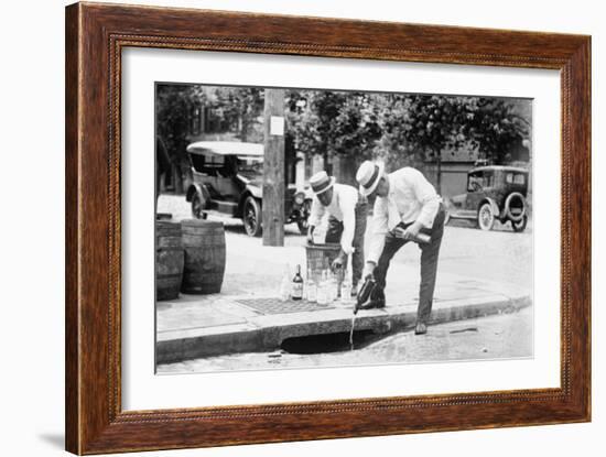 Agents Pouring Liquor Down a Sewer on the Street-null-Framed Art Print