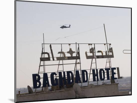 AH-64 Apache in Flight over the Baghdad Hotel in Central Baghdad, Iraq-Stocktrek Images-Mounted Photographic Print