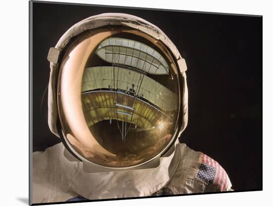 Air and Space: Apollo Helmet Visor reflecting the 1903 Wright Flyer-null-Mounted Photographic Print