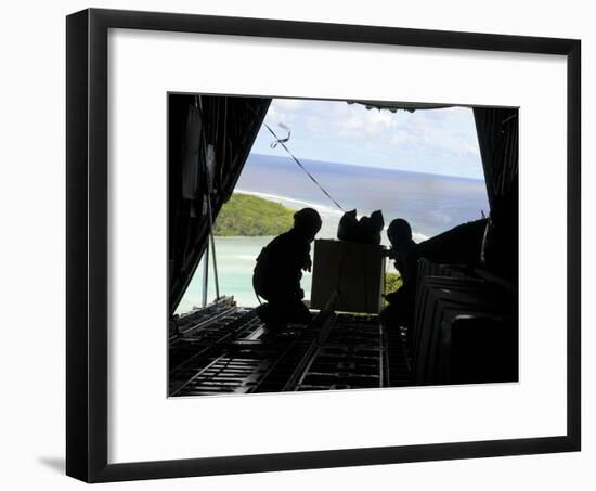 Airmen Push Out a Pallet of Donated Goods from a C-130 Hercules-Stocktrek Images-Framed Photographic Print