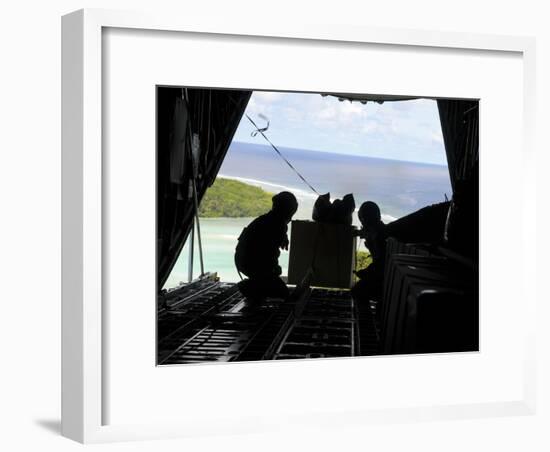 Airmen Push Out a Pallet of Donated Goods from a C-130 Hercules-Stocktrek Images-Framed Photographic Print