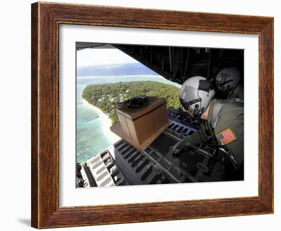 Airmen Push Out a Pallet of Donated Goods Over the Island of Yap from a C-130 Hercules-Stocktrek Images-Framed Photographic Print