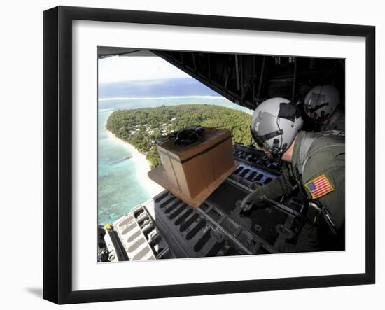 Airmen Push Out a Pallet of Donated Goods Over the Island of Yap from a C-130 Hercules-Stocktrek Images-Framed Photographic Print