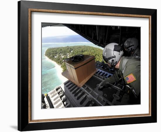 Airmen Push Out a Pallet of Donated Goods Over the Island of Yap from a C-130 Hercules-Stocktrek Images-Framed Photographic Print