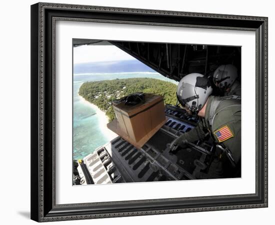 Airmen Push Out a Pallet of Donated Goods Over the Island of Yap from a C-130 Hercules-Stocktrek Images-Framed Photographic Print