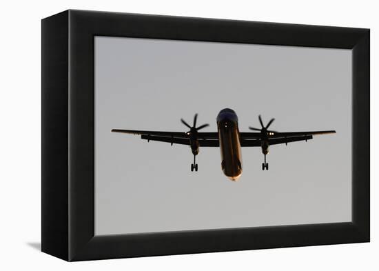 Airplane approaches with lowered wheels-Charles Bowman-Framed Premier Image Canvas