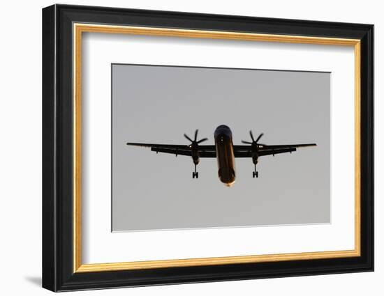 Airplane approaches with lowered wheels-Charles Bowman-Framed Photographic Print