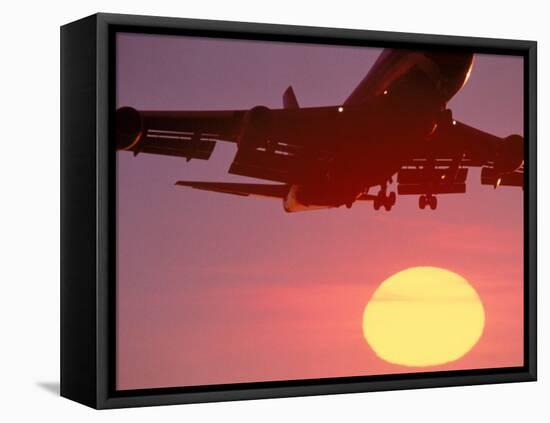 Airplane in Flight During Sunrise, Sunset-Mitch Diamond-Framed Premier Image Canvas