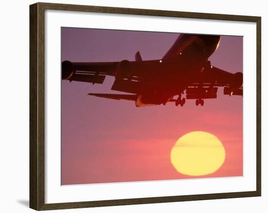 Airplane in Flight During Sunrise, Sunset-Mitch Diamond-Framed Photographic Print