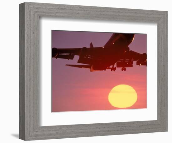 Airplane in Flight During Sunrise, Sunset-Mitch Diamond-Framed Photographic Print