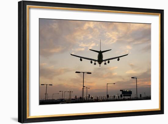 Airplane landing-Charles Bowman-Framed Photographic Print