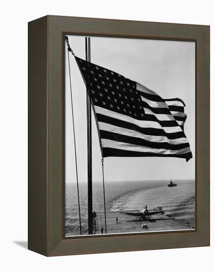 Airplane on Battleship Deck with American Flag in Foreground, World War II-null-Framed Stretched Canvas