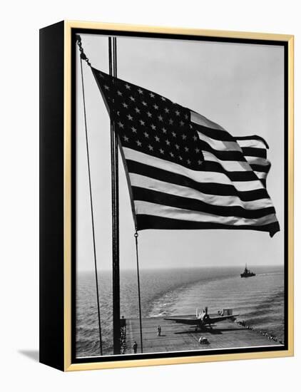 Airplane on Battleship Deck with American Flag in Foreground, World War II-null-Framed Stretched Canvas