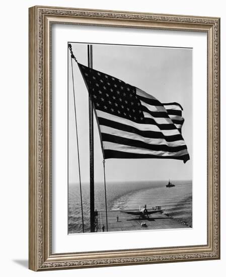 Airplane on Battleship Deck with American Flag in Foreground, World War II-null-Framed Photo