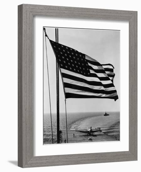 Airplane on Battleship Deck with American Flag in Foreground, World War II-null-Framed Photo