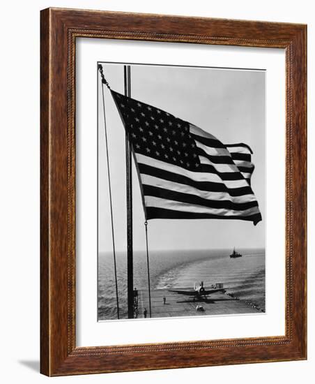 Airplane on Battleship Deck with American Flag in Foreground, World War II-null-Framed Photo