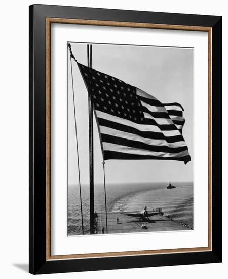 Airplane on Battleship Deck with American Flag in Foreground, World War II-null-Framed Photo