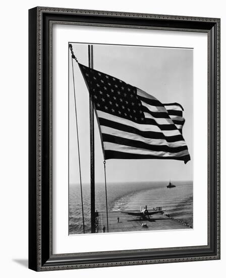 Airplane on Battleship Deck with American Flag in Foreground, World War II-null-Framed Photo