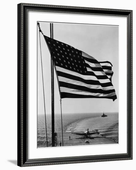 Airplane on Battleship Deck with American Flag in Foreground, World War II--Framed Photo